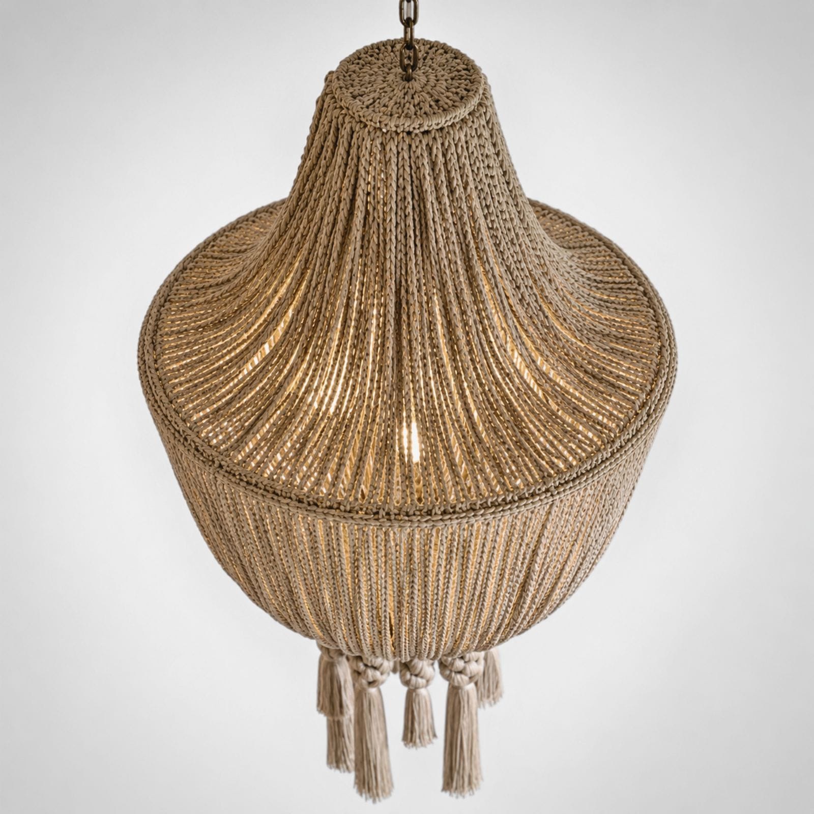 SOUL is a handwoven jute pendant lamp from BOHO’s RAYAA Collection, crafted with natural fibers, braided tassels, and a warm earthy glow for soulful interiors.