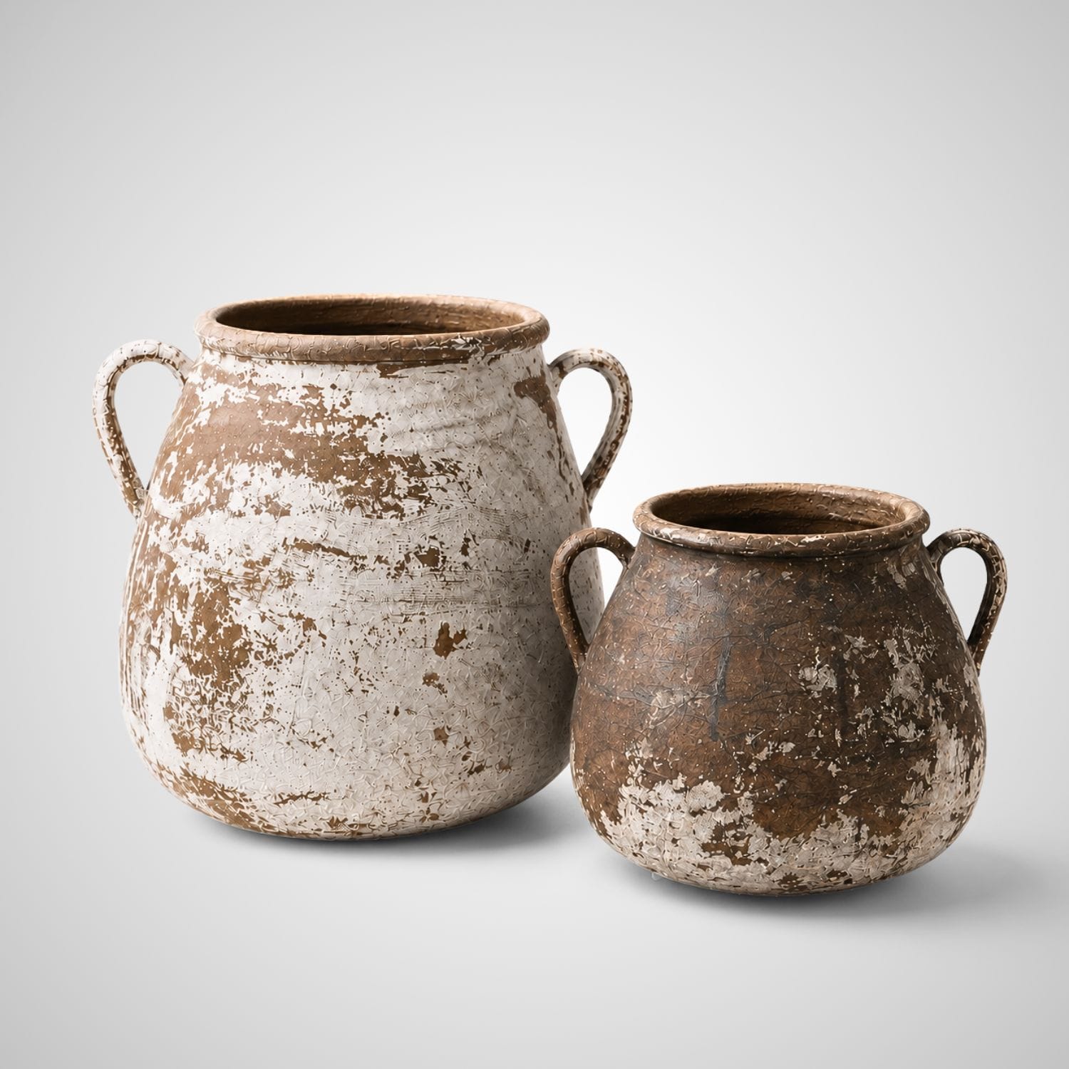 PATINA PRAYER handcrafted terracotta vessel set featuring two weathered clay vessels with handles, sunbaked terracotta tones, and distressed ivory patina.