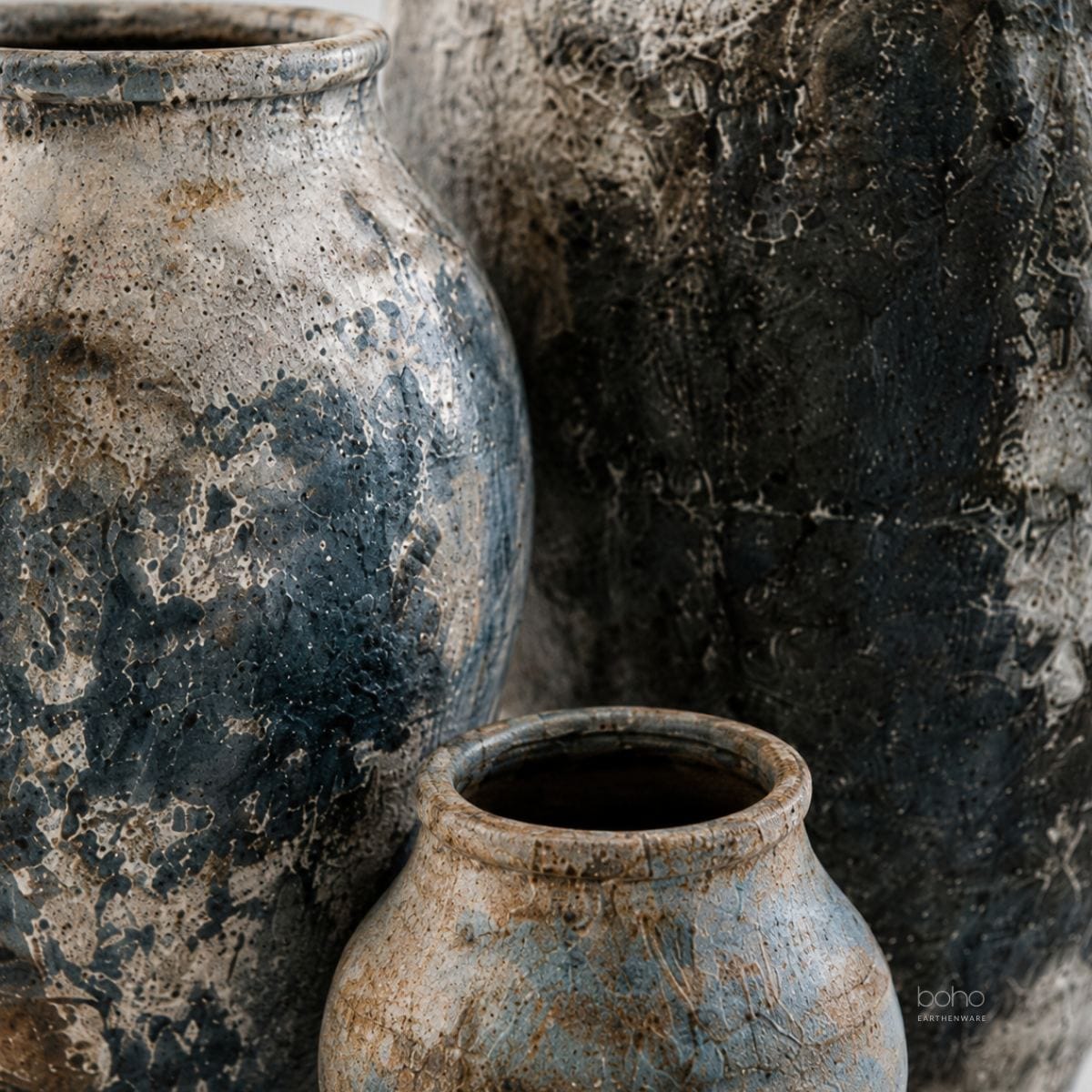 A sculptural trio of handcrafted terracotta vessels featuring blue-grey mineral patina, weathered textures, and ancient-inspired beauty. Perfect for contemporary, rustic, coastal, and artfully curated interiors.