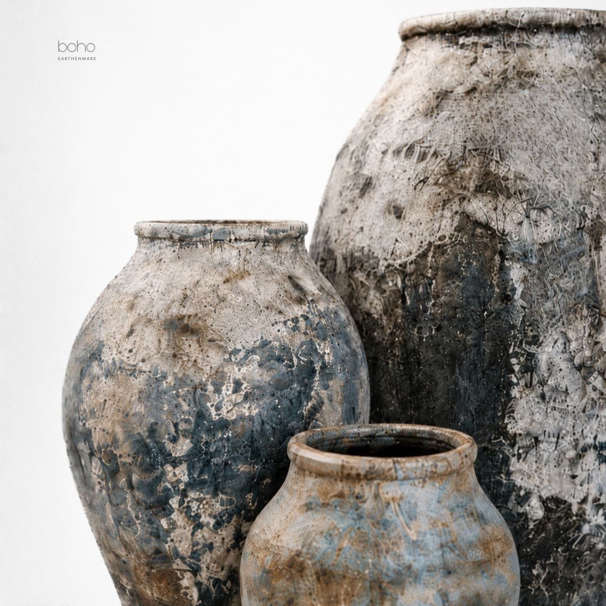 A sculptural trio of handcrafted terracotta vessels featuring blue-grey mineral patina, weathered textures, and ancient-inspired beauty. Perfect for contemporary, rustic, coastal, and artfully curated interiors.