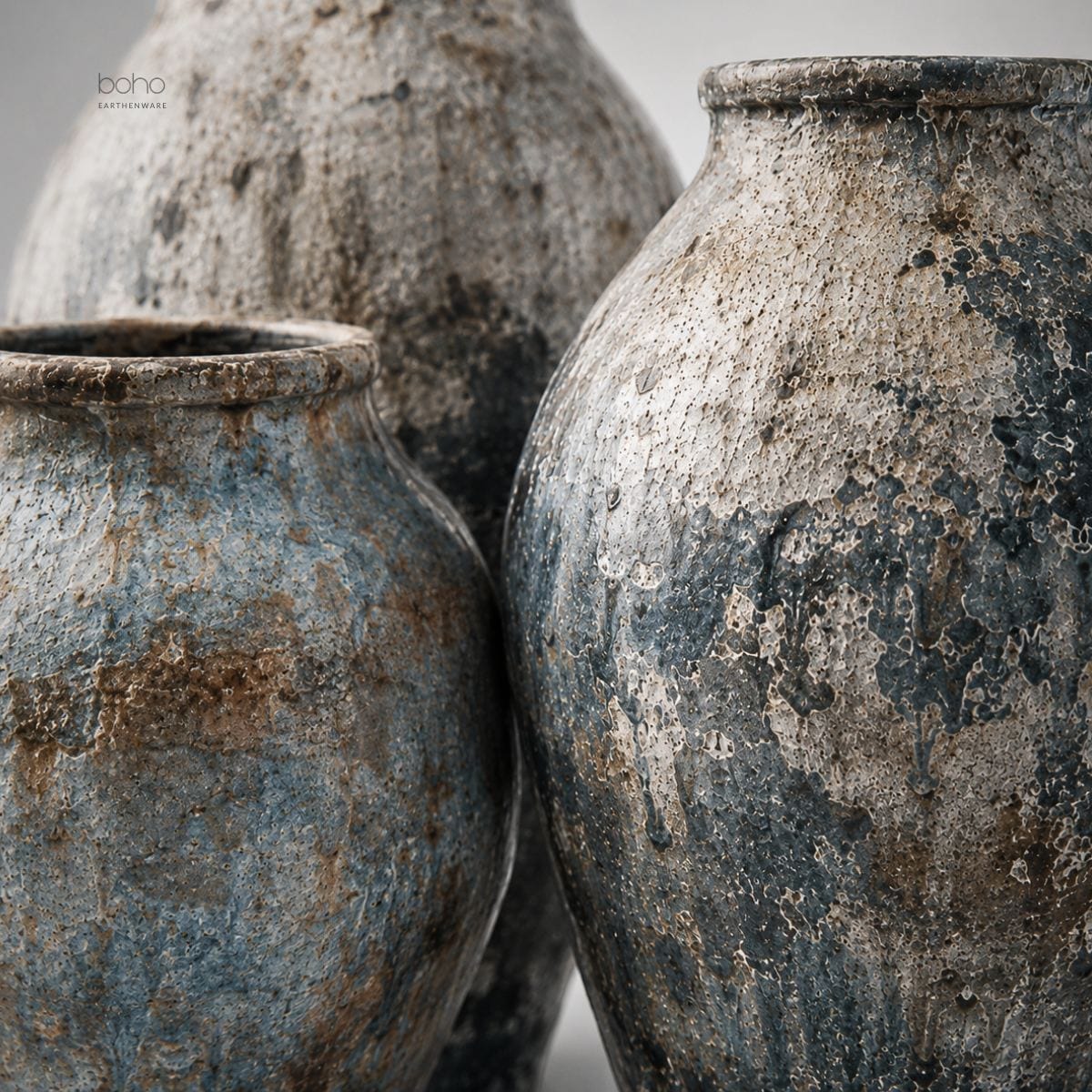 A sculptural trio of handcrafted terracotta vessels featuring blue-grey mineral patina, weathered textures, and ancient-inspired beauty. Perfect for contemporary, rustic, coastal, and artfully curated interiors.